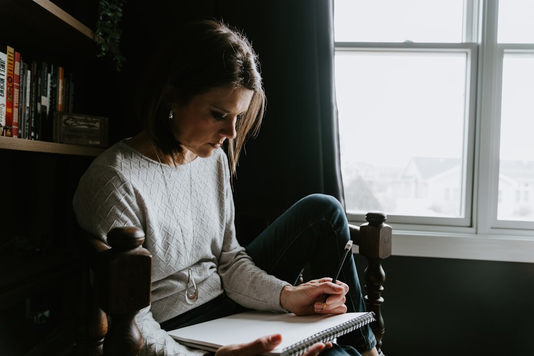 woman writing in notebook