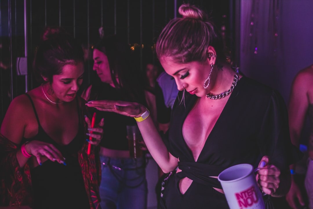 Two Brazilian women having a warm, attentive conversation over coffee